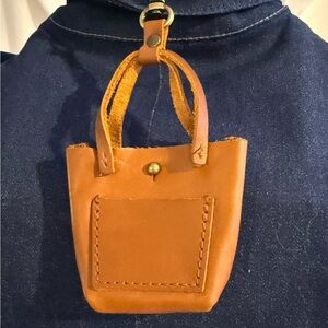 Portland Leather Tiny Triangle Keychain in the color Honey.